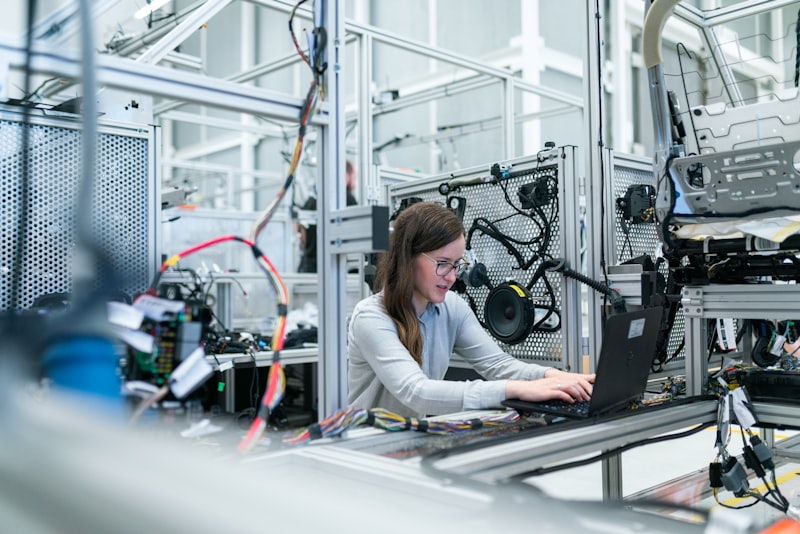 Woman engineer assembling smart device
