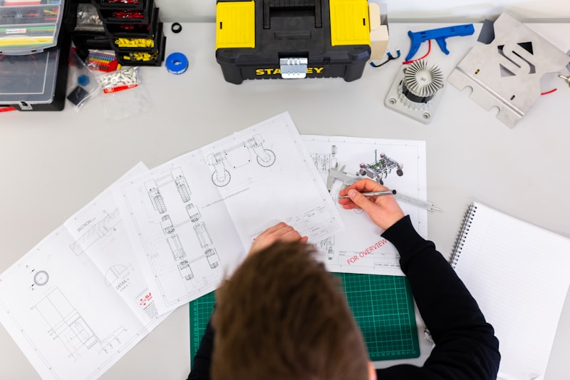 Engineer testing circuit with oscilloscope